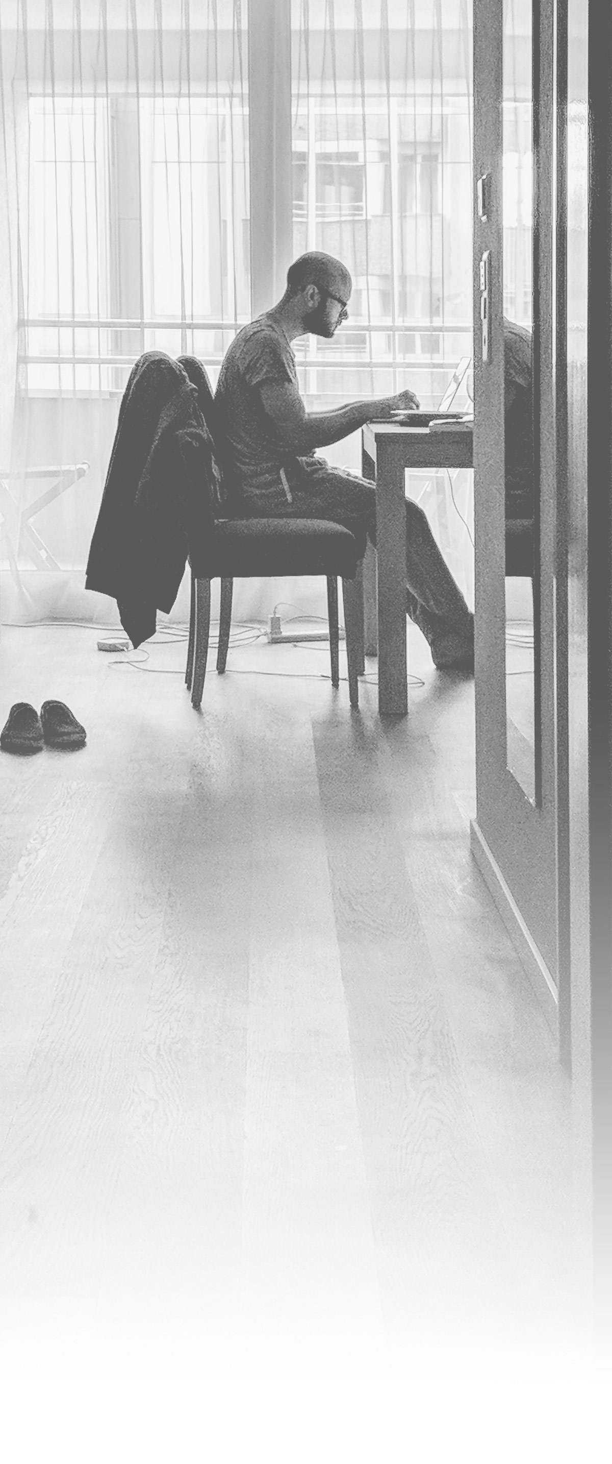 Anthony Ullmann working on his laptop